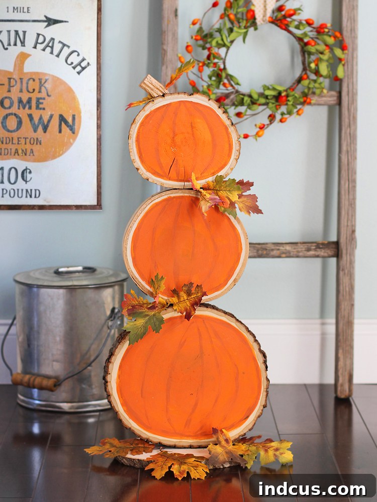 Stacked Wood Slice Pumpkins with Painted Veins and Faux Leaves