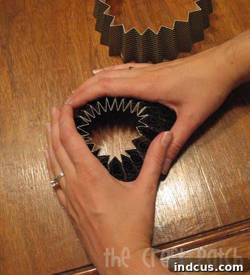 Accordion paper flower collapsing into a flat shape