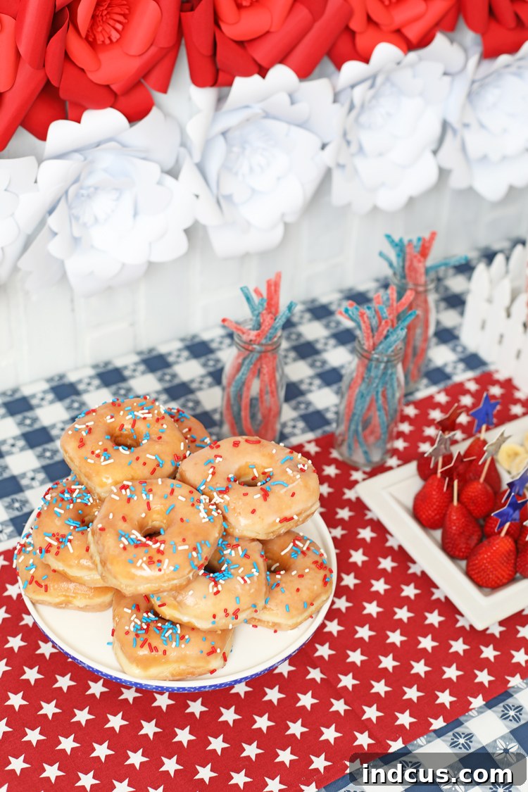 Delicious Fourth of July party food spread with red, white, and blue treats.