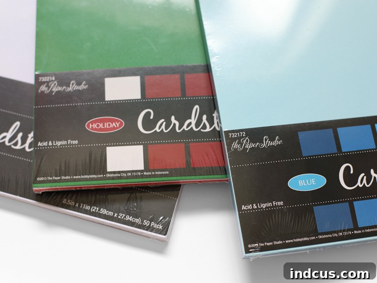 Various packs of colorful cardstock from Hobby Lobby for paper flower crafting.