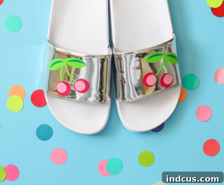 Finished personalized summer sandals with cherry vinyl decals, ready for wear