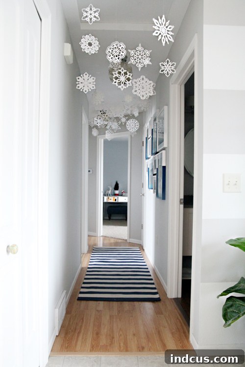 paper snowflakes hanging from ceiling