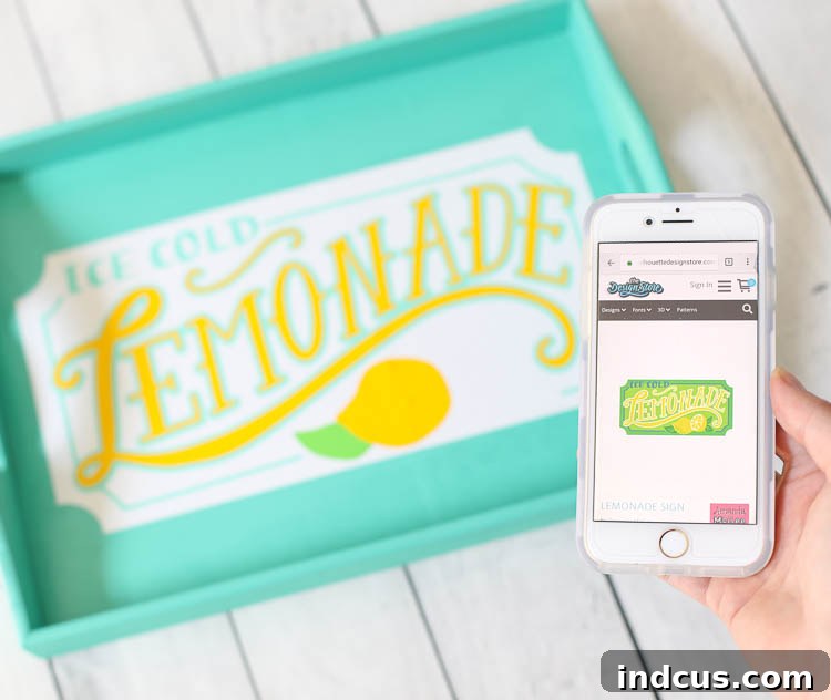The layered vinyl design is complete on the wooden tray, showcasing the 'Lemonade' text with its white background, blue accents, and yellow lettering, all perfectly aligned.