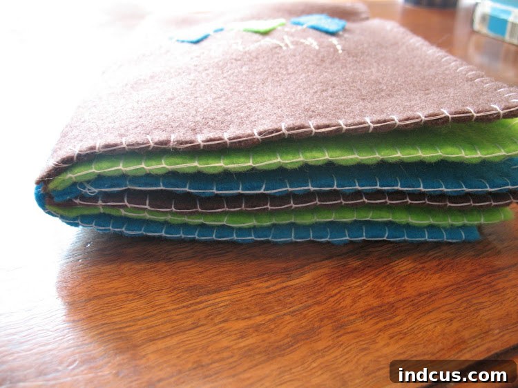 My Felt Name Book 5 Side view of the handmade felt name book, clearly showing its thickness and the stitched binding