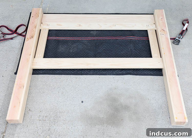 Using a band clamp to secure the headboard assembly
