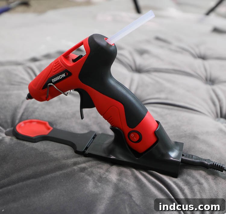 Stapling the upholstery fabric to the back of the panel