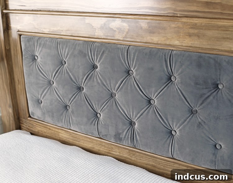 Finished bedroom with the DIY wood and velvet tufted headboard