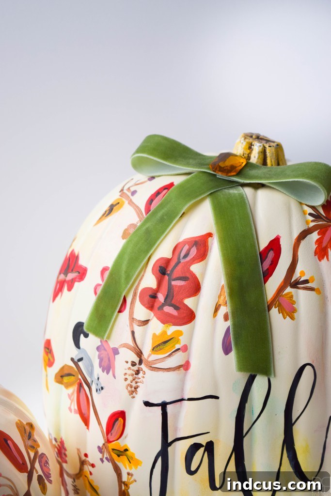 Gorgeous floral fall painted pumpkins with autumn colors
