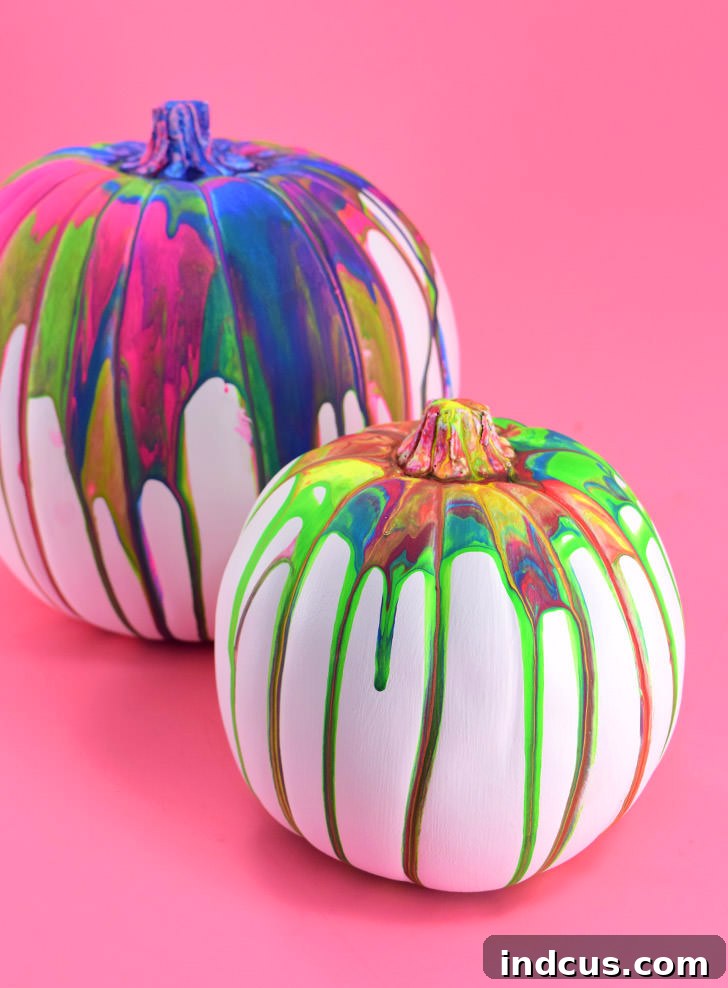 Pour art painted pumpkin with vibrant drips