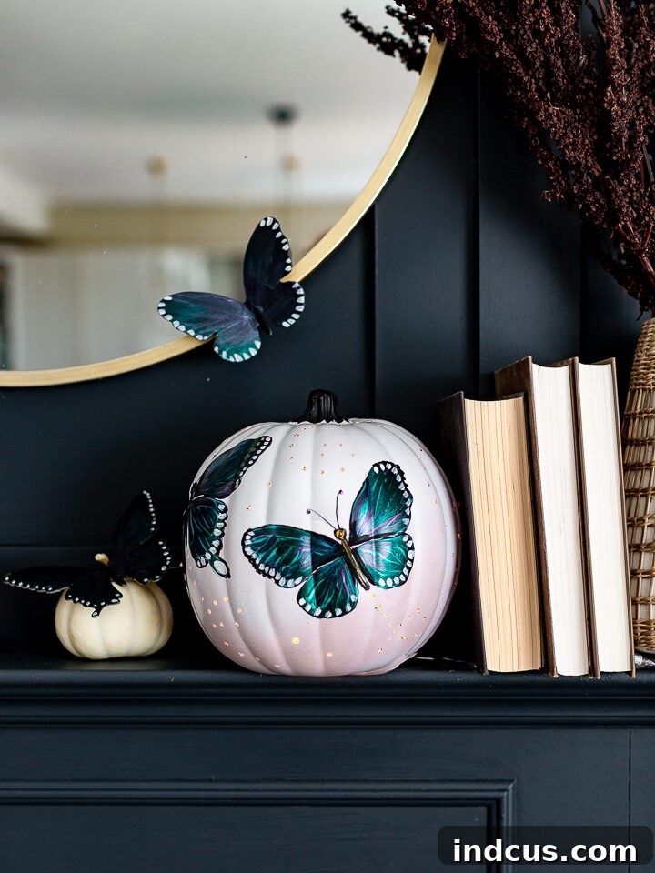 Butterfly painted pumpkin luminary with light