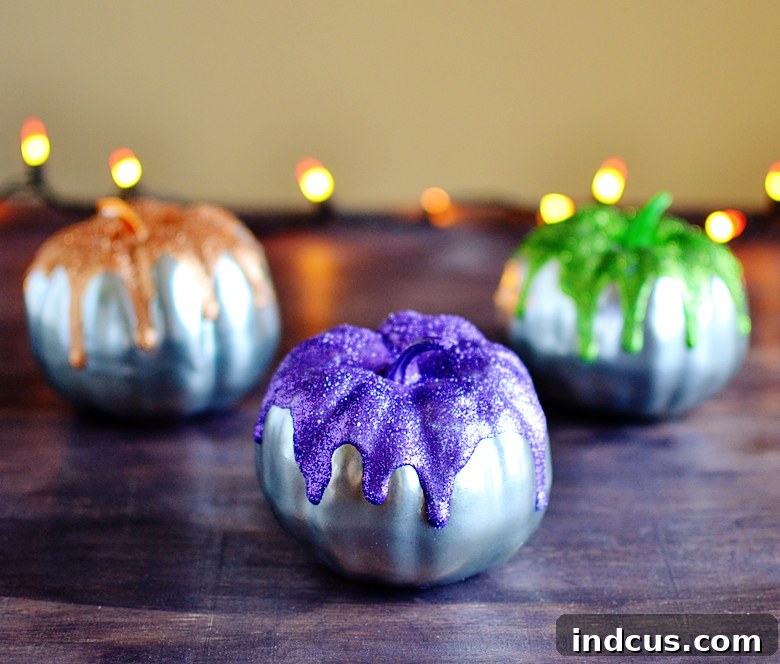 Metallic glitter drip pumpkins with vibrant colors