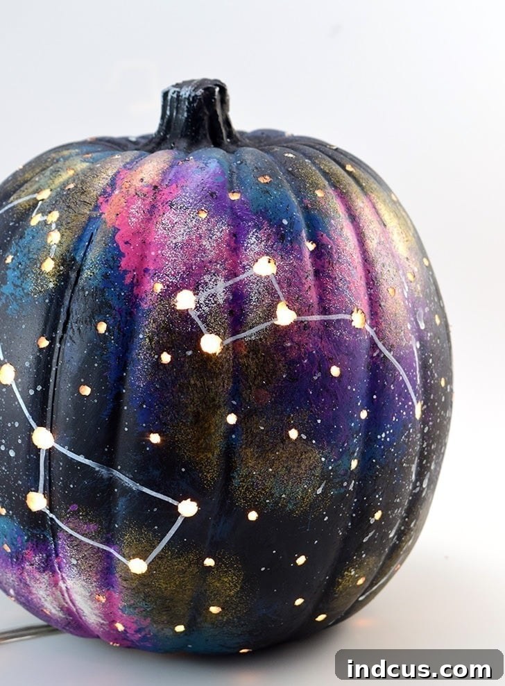 Galaxy pumpkin painting idea with lights