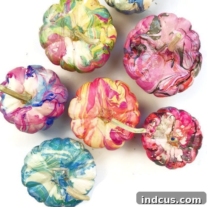 Marbled painted pumpkins created with nail polish