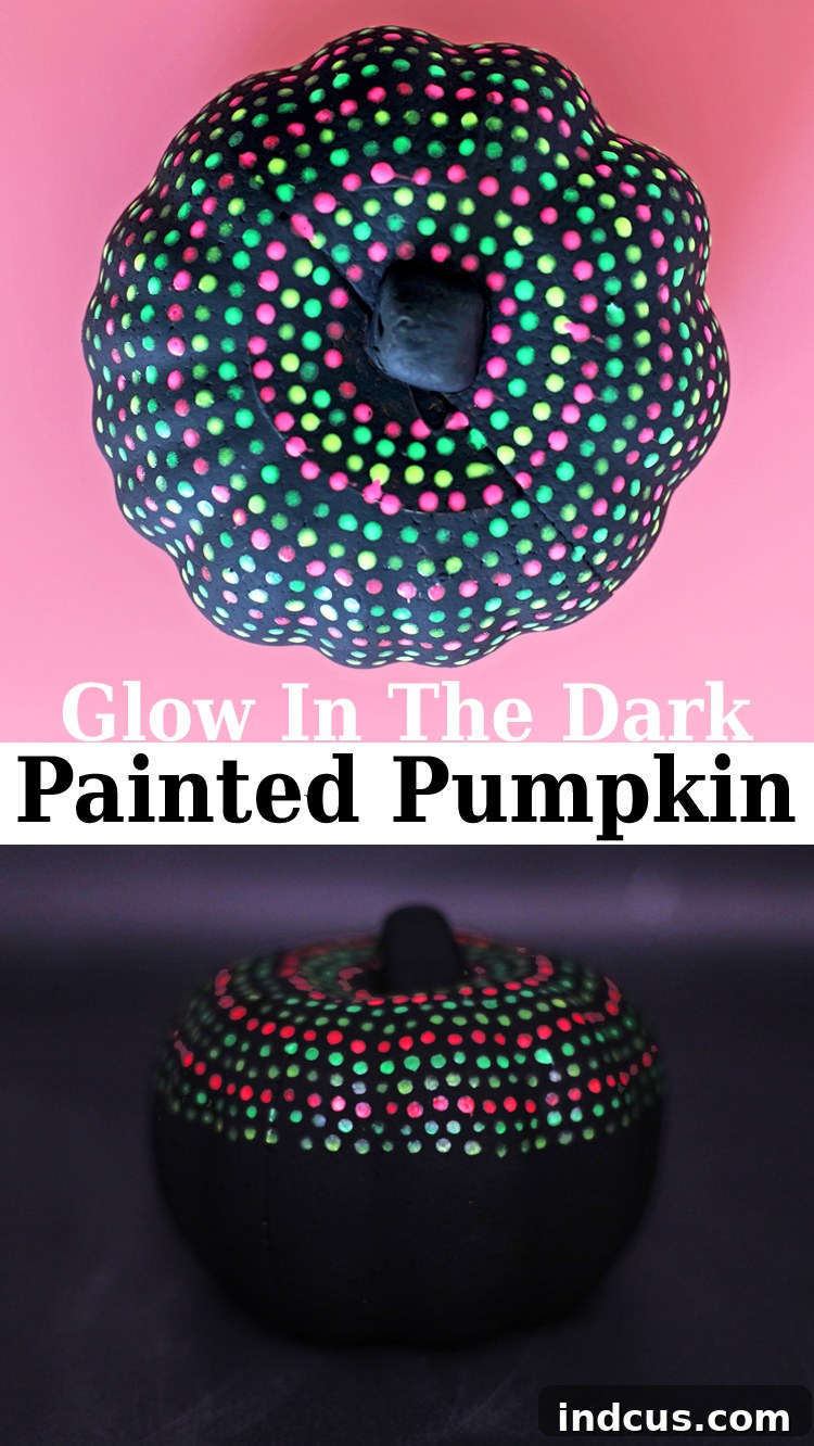 A stunning vertical image of a glow in the dark painted pumpkin with dots, perfect for pinning on Pinterest.