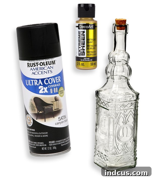 Crafting materials laid out for DIY spooky Halloween candle holders: various glass bottles, black spray paint, gold craft paint, and white taper candles.