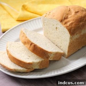 Whole Grain Wonder Bread 3 A pristine, golden-crusted loaf of homemade white bread, perfectly risen.
