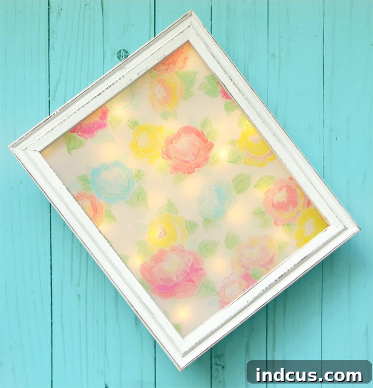 DIY whimsical floral night light crafted from a shadowbox