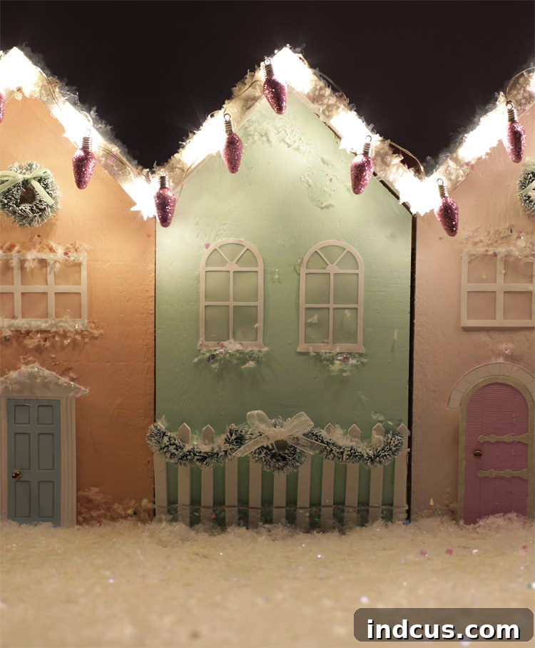 An overhead shot of the miniature Christmas village, showcasing the vibrant colors and detailed decorations under soft lighting.