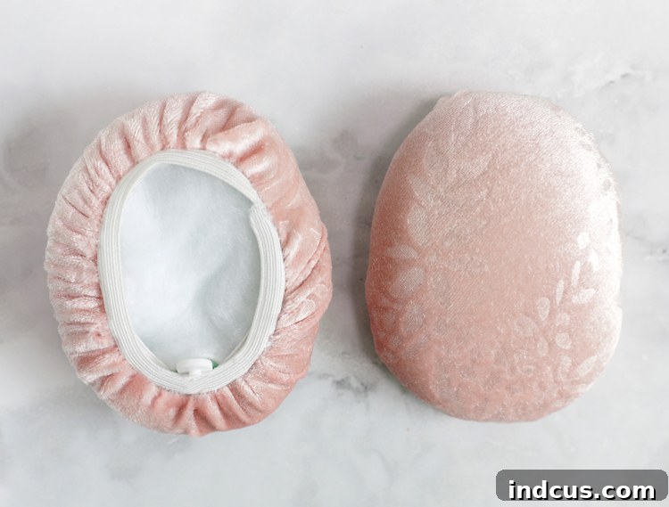 Close-up of a custom ear muff with fabric cover smoothly stretched over the frame