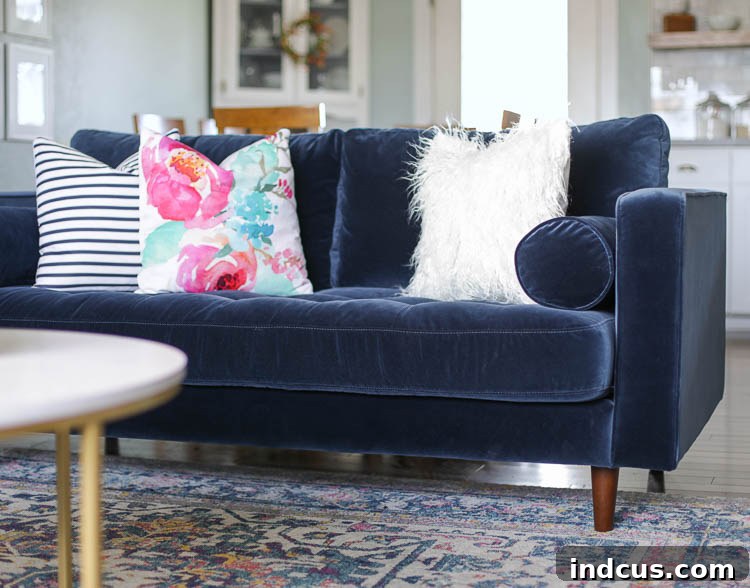Delivery personnel carefully placing felt pads on sofa legs to protect wood floors