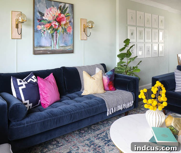 Elegant, sleek legs of the Article Sven navy velvet sofa on wood flooring