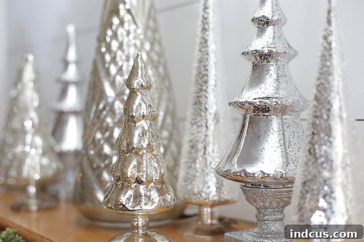 various sizes of mercury glass Christmas trees