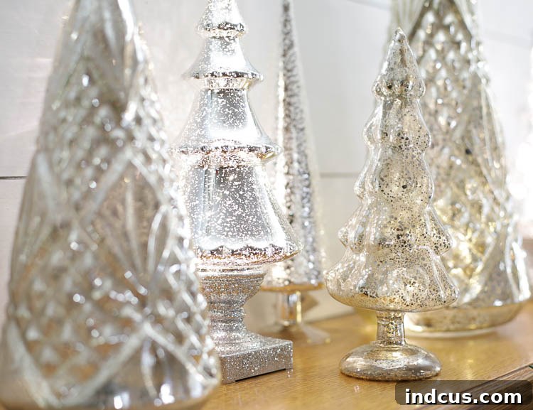 light up mercury glass christmas trees creating a cozy glow