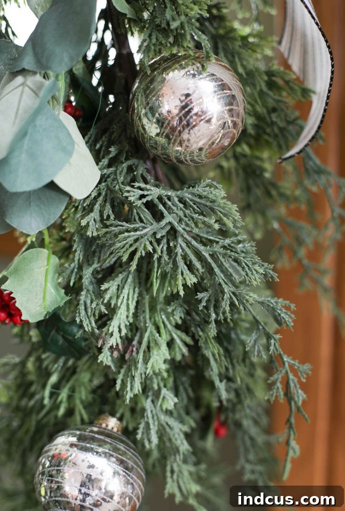 mercury glass ball ornaments on cedar garland