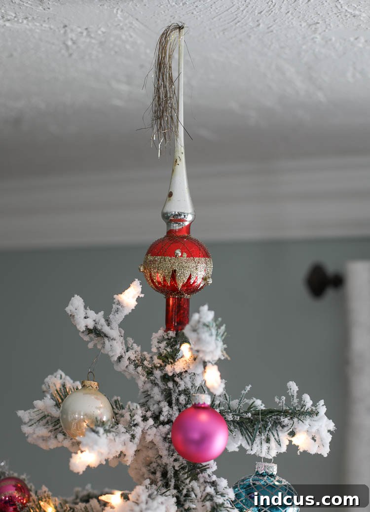Close-up of a cherished vintage Shiny Brite Christmas tree topper