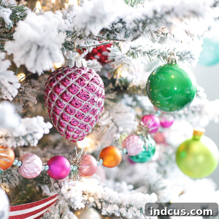 Close-up of colorful retro Christmas decorations on a flocked tree