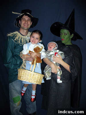 Wizard of Oz family Halloween costume featuring Dorothy, Tin Man, and the Wicked Witch