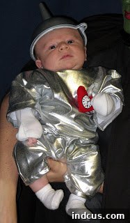 Baby Tin Man in a handmade DIY Halloween costume with funnel hat and heart