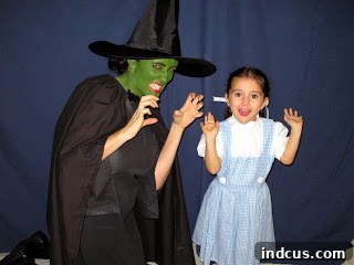 Dorothy and the Wicked Witch of the West in handmade family Halloween costumes