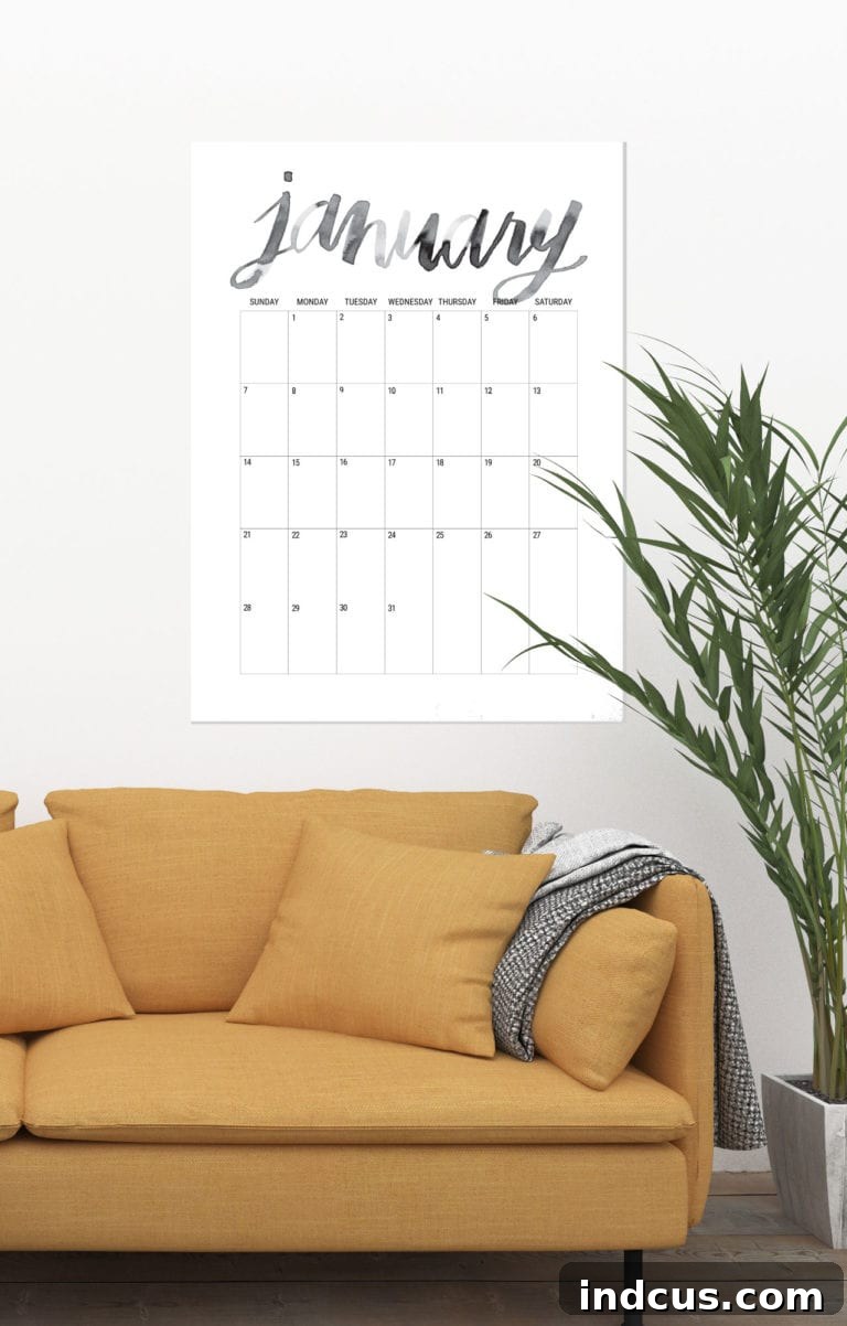 An oversized hand-lettered calendar for 2019 by Shrimp Salad Circus, featuring unique, artistic typography for each month, making a bold statement in any room.