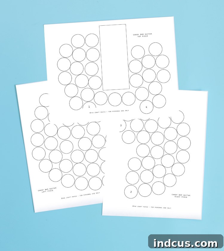 Sections of a printed candy bar guitar template laid out, ready to be cut and assembled