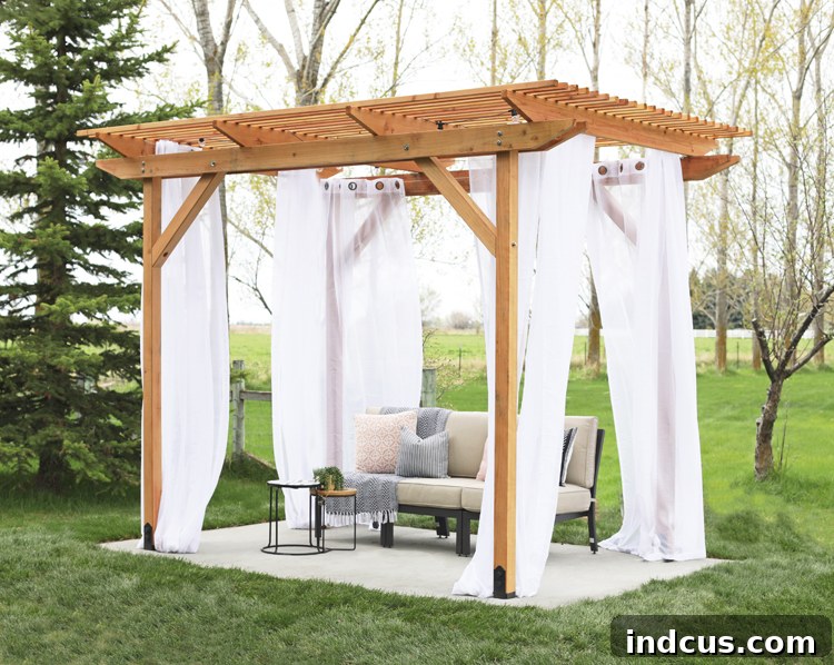 Handcrafted Redwood Shade Solution 5 Completed redwood pergola featuring sheer curtains and outdoor string lights