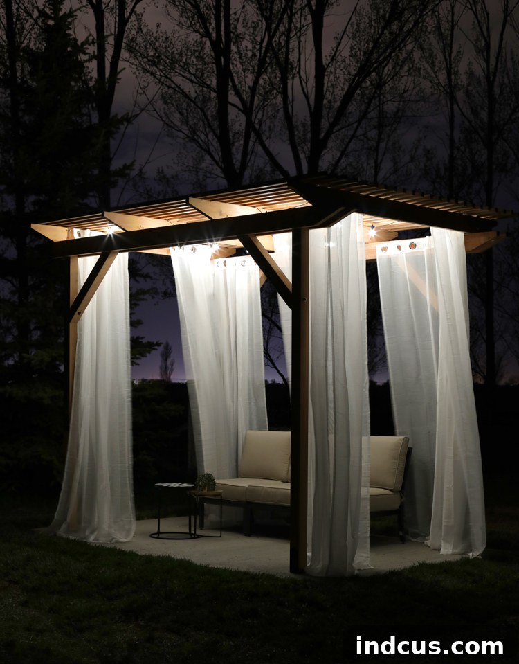 Handcrafted Redwood Shade Solution 8 Redwood pergola illuminated at night with cafe string lights