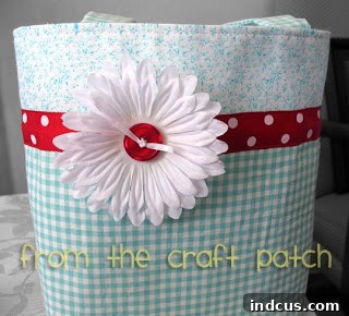 Smile Satchel 2 Finished handmade cotton fabric bag with red accents and a unique pattern, showcasing the intricate details and craftsmanship.