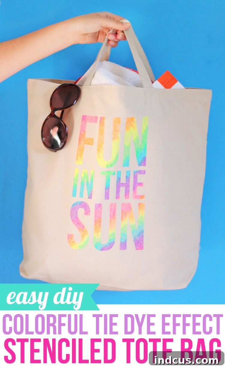 A person proudly displaying their newly designed DIY stenciled tote bag, featuring a colorful 'Sunshine' motif and neon fabric marker art.