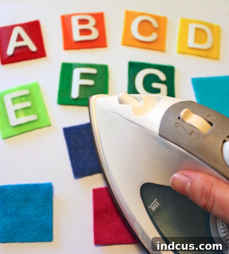Detailed process of making a cute felt alphabet matching game with iron-on vinyl