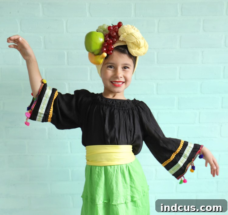 Effortless Carmen Miranda Halloween Look 4 Detailed shot of a yellow fabric headscarf being tied, demonstrating the initial steps for the Carmen Miranda fruit headdress.