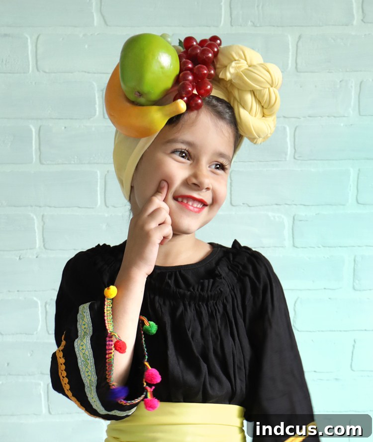 Effortless Carmen Miranda Halloween Look 5 A candid photo of the young girl in her Carmen Miranda costume, striking a confident and playful pose, showcasing her spunky attitude.