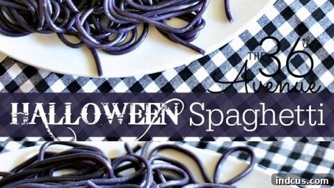 Halloween spaghetti with black noodles and olive eyeballs.
