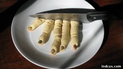 Witch fingers breadsticks with almond 'nails'.