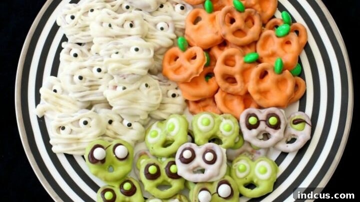 Three different Halloween themed pretzels: ghost, mummy, and monster.