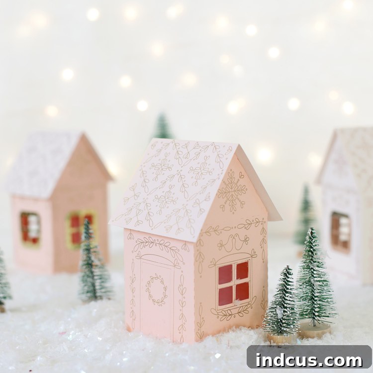 Stunning metallic foiled miniature paper Christmas houses crafted with Foil Quill and Silhouette Cameo.