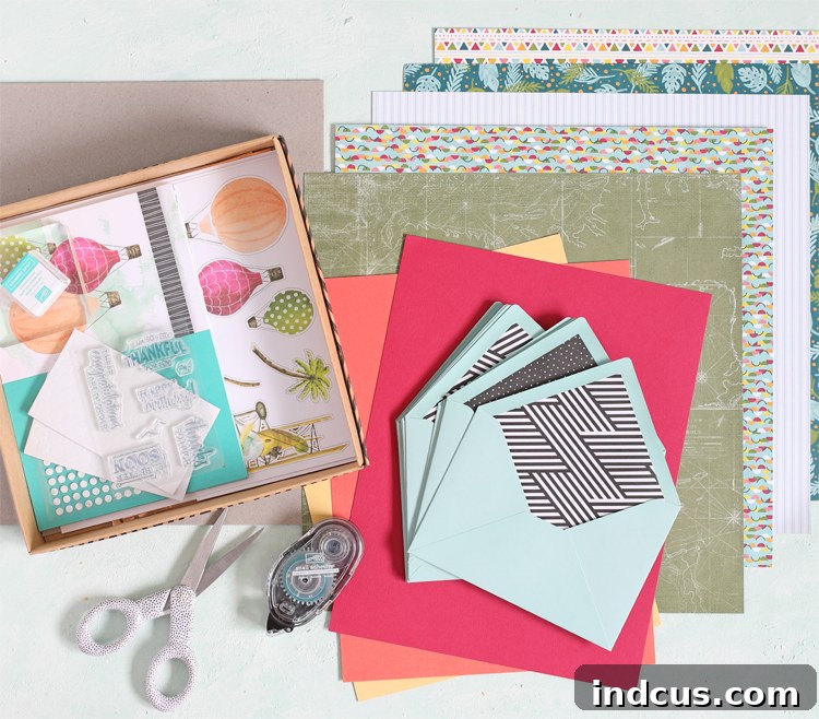 Close-up of decorative paper and chipboard being prepared for an envelope book cover.