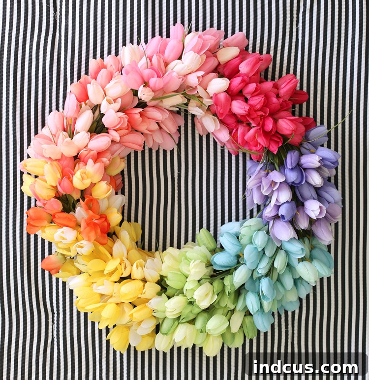 Completed DIY rainbow tulip wreath, vibrant and full of color, ready for display