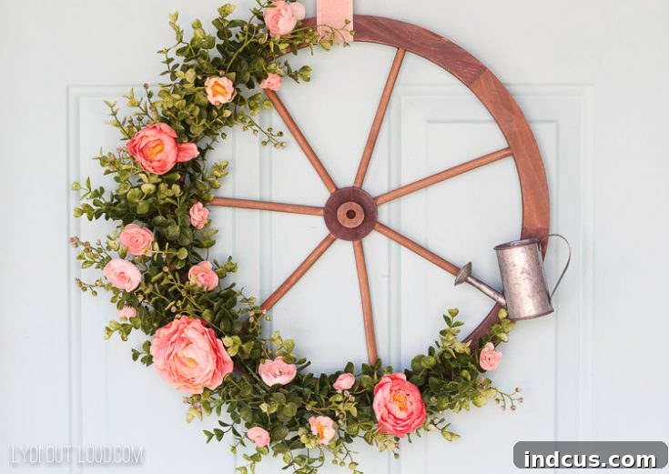 Rustic Wagon Wheel Wreath embellished with spring flowers