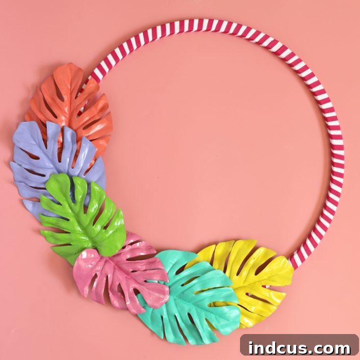 Bold painted monstera leaf wreath on a hoop
